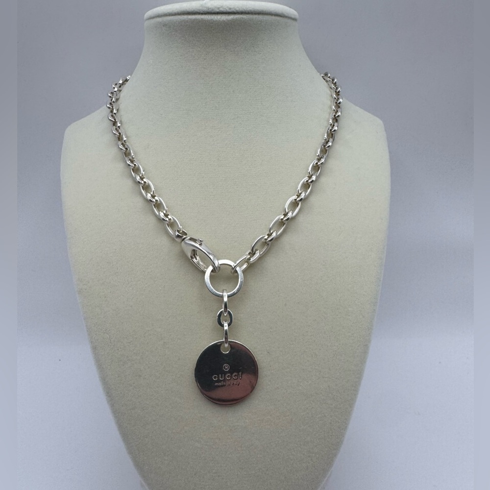 Gucci trademark logo silver round tag charm necklace.